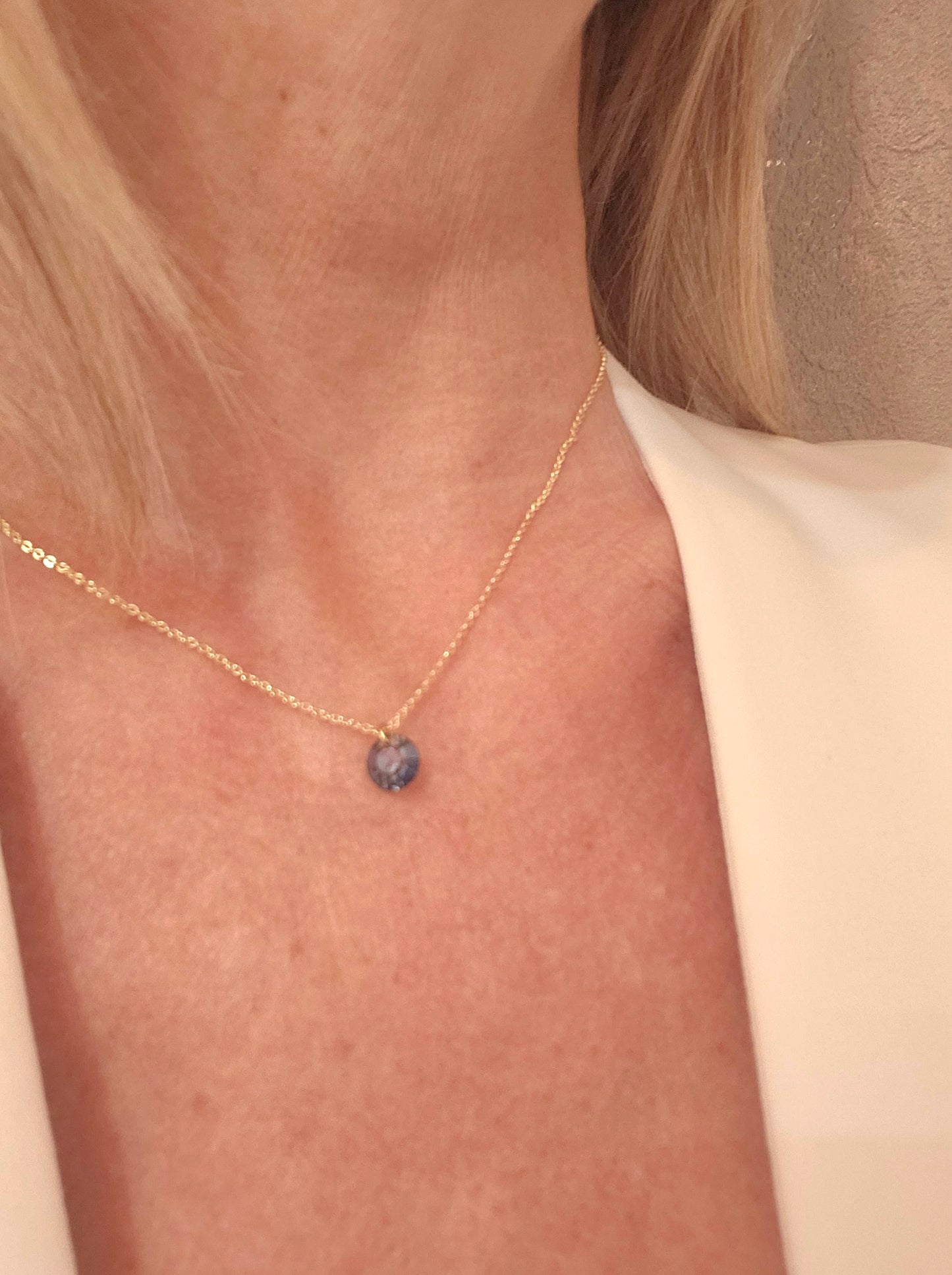 Sapphire necklace enhanced by a blue cabochon crystal