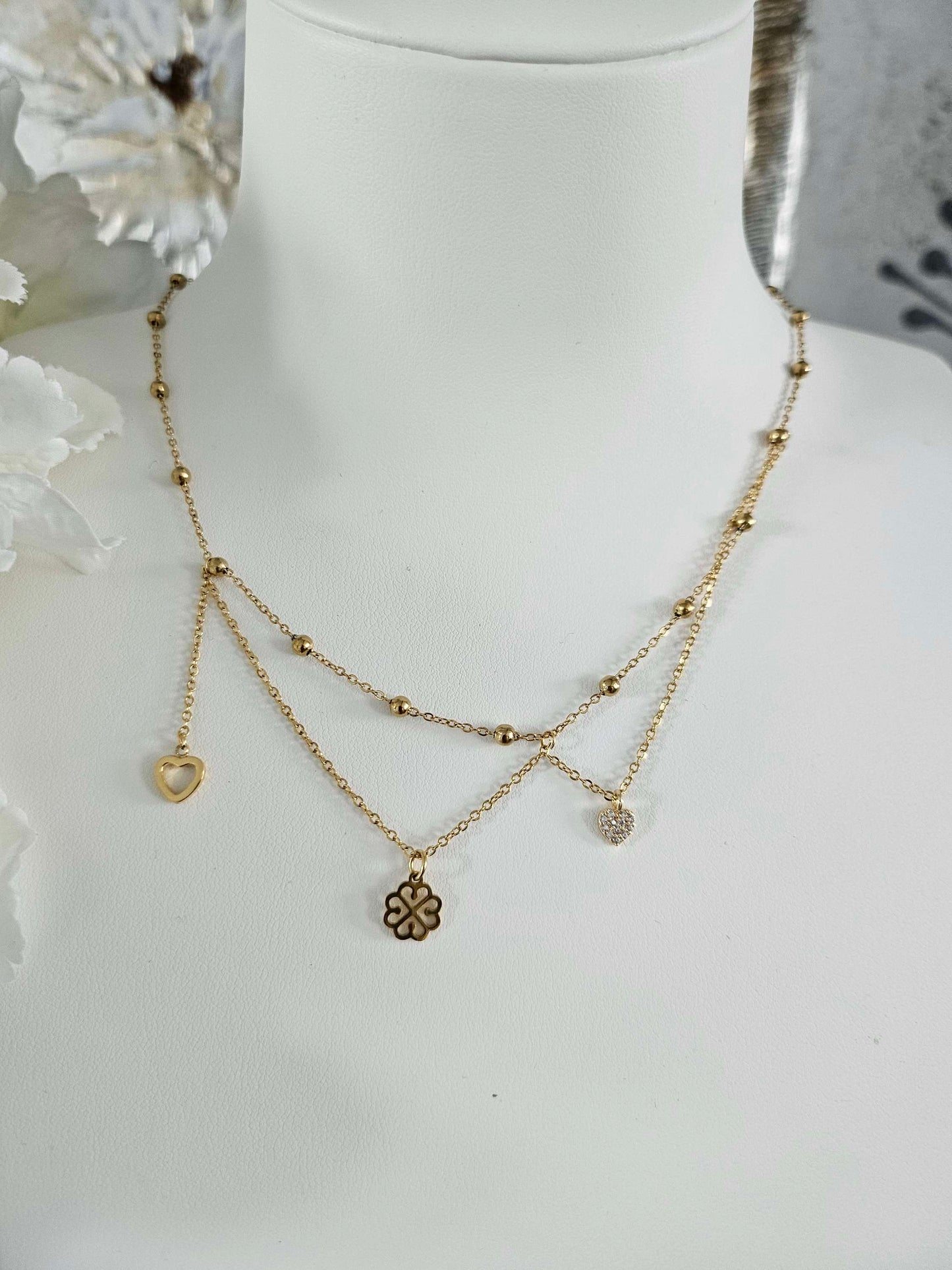Galante gold-plated necklace – asymmetrical clover, heart and diamond heart pendants.