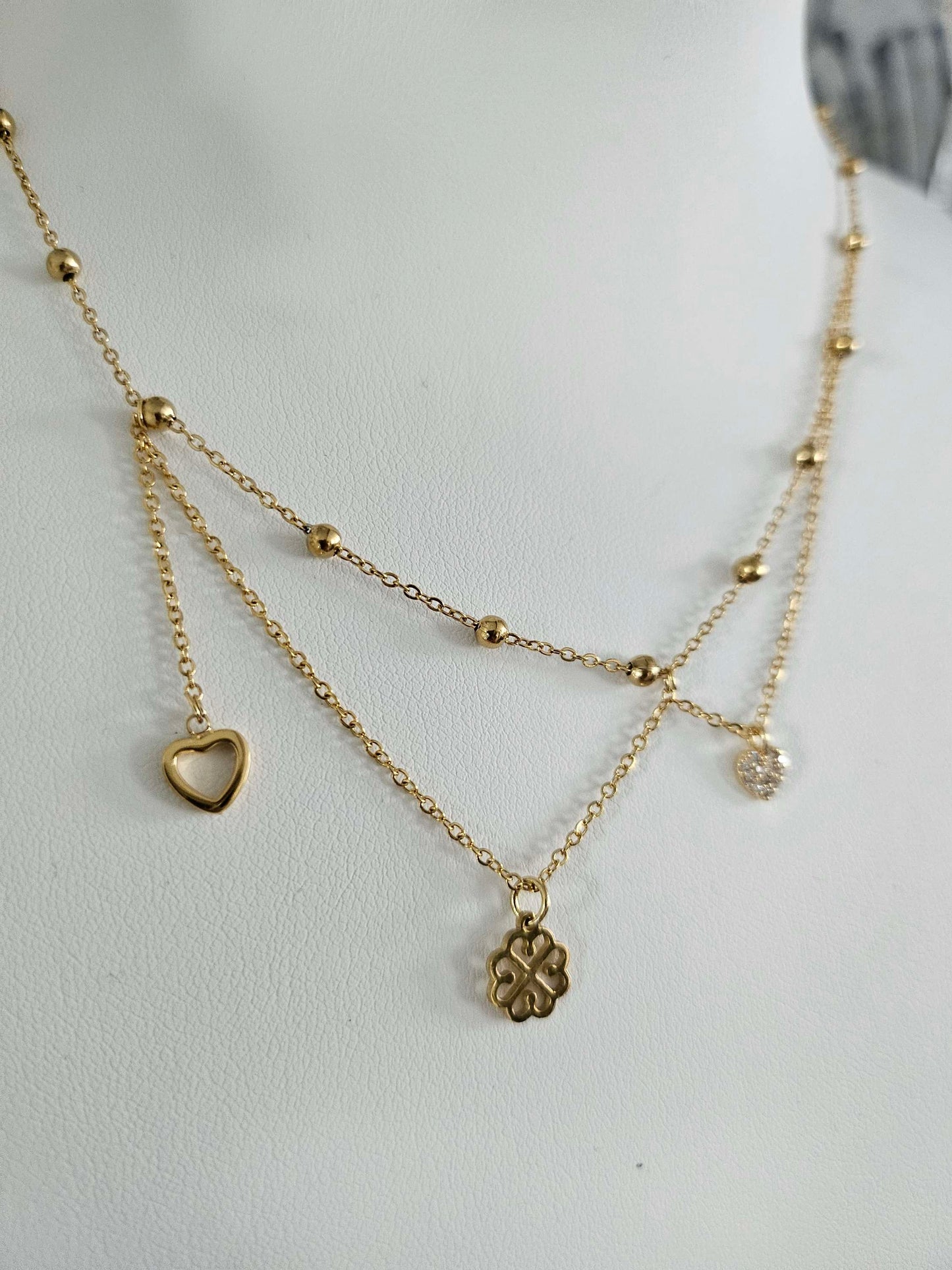 Galante gold-plated necklace – asymmetrical clover, heart and diamond heart pendants.
