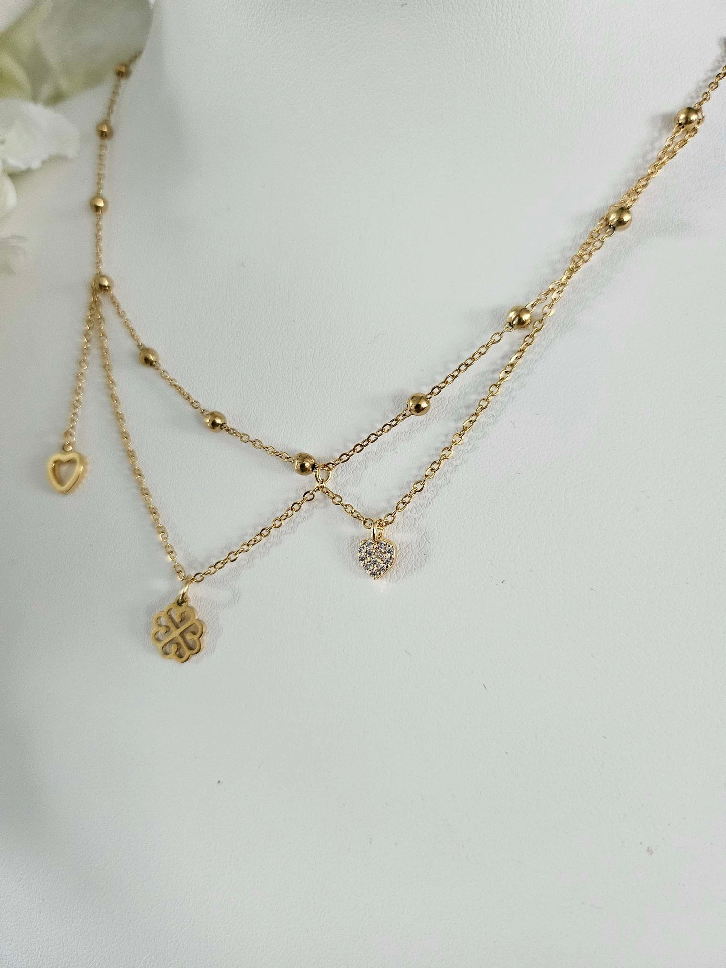 Galante gold-plated necklace – asymmetrical clover, heart and diamond heart pendants.