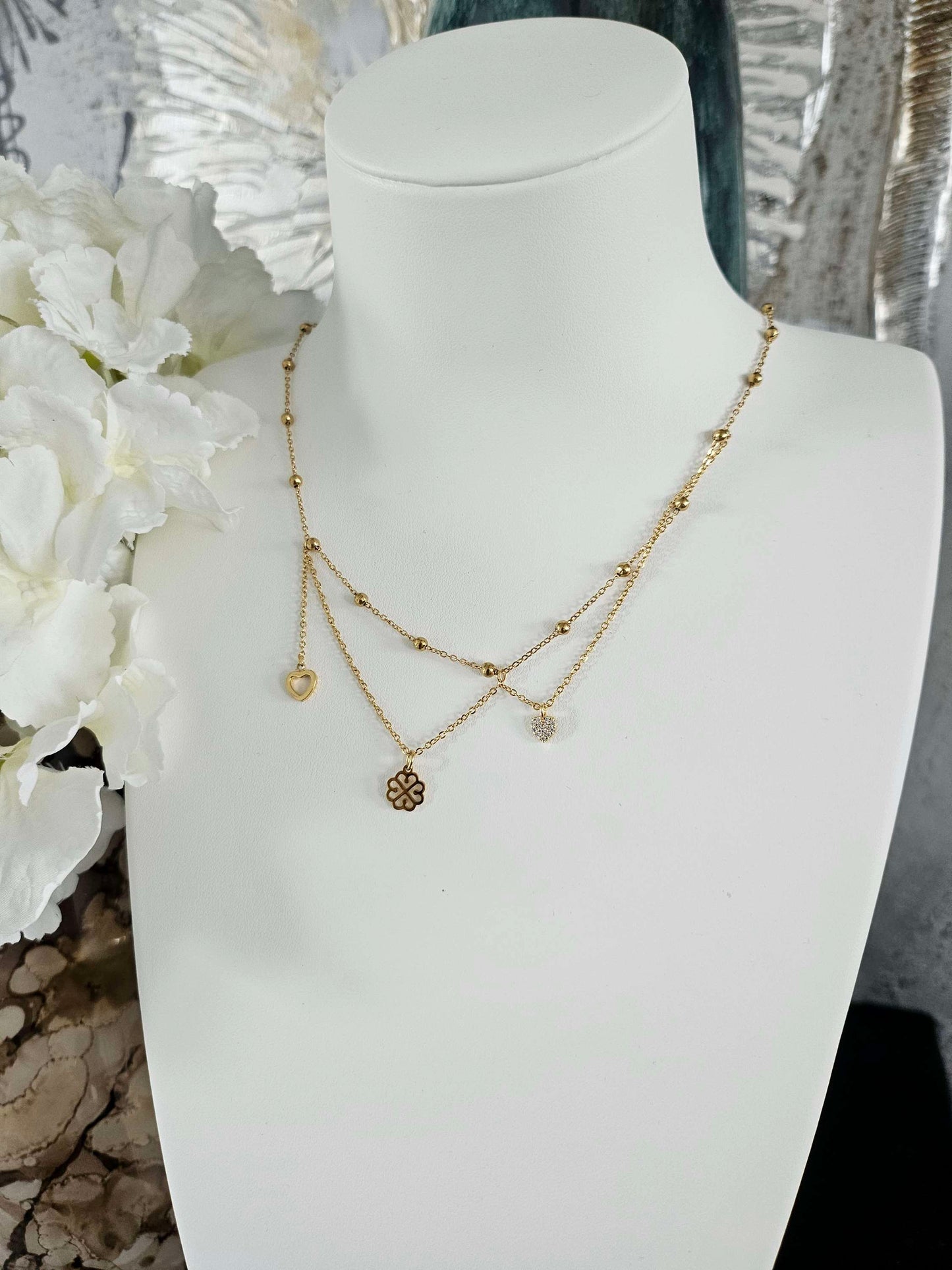 Galante gold-plated necklace – asymmetrical clover, heart and diamond heart pendants.