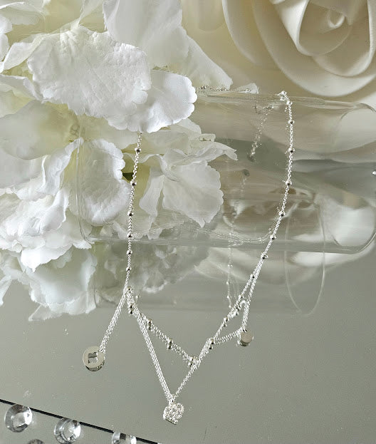 Galante silver necklace – asymmetrical clover, heart and medal pendants on ball chain.